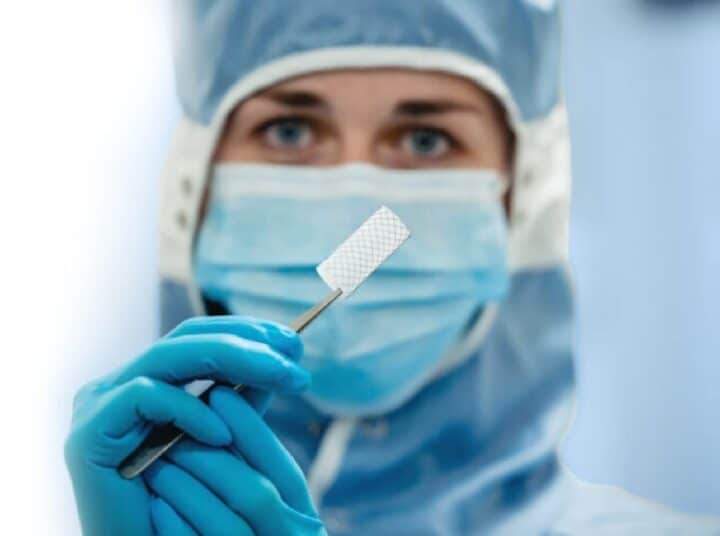 Medical professional handling a precision medical device.